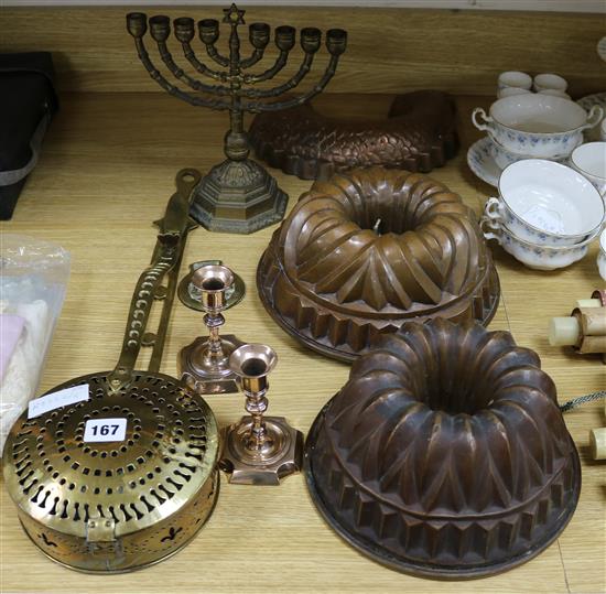 A quantity of brass and copper including a pair of candlesticks, two jelly moulds, etc